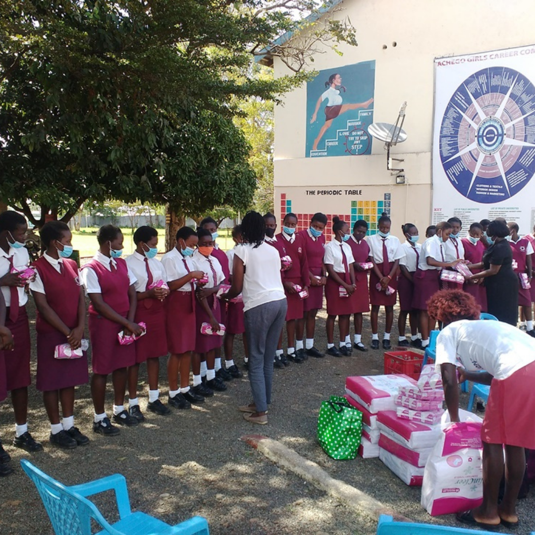 Achego Girls students receiving sanitary supplies