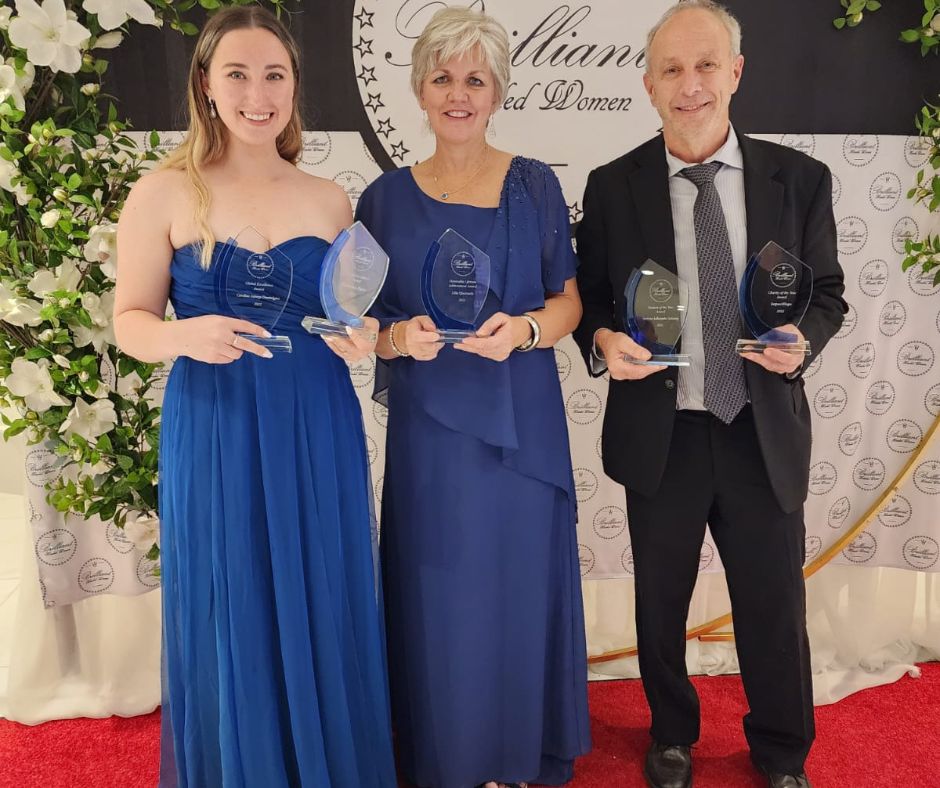 Hannah, Lila and Brad with the awards