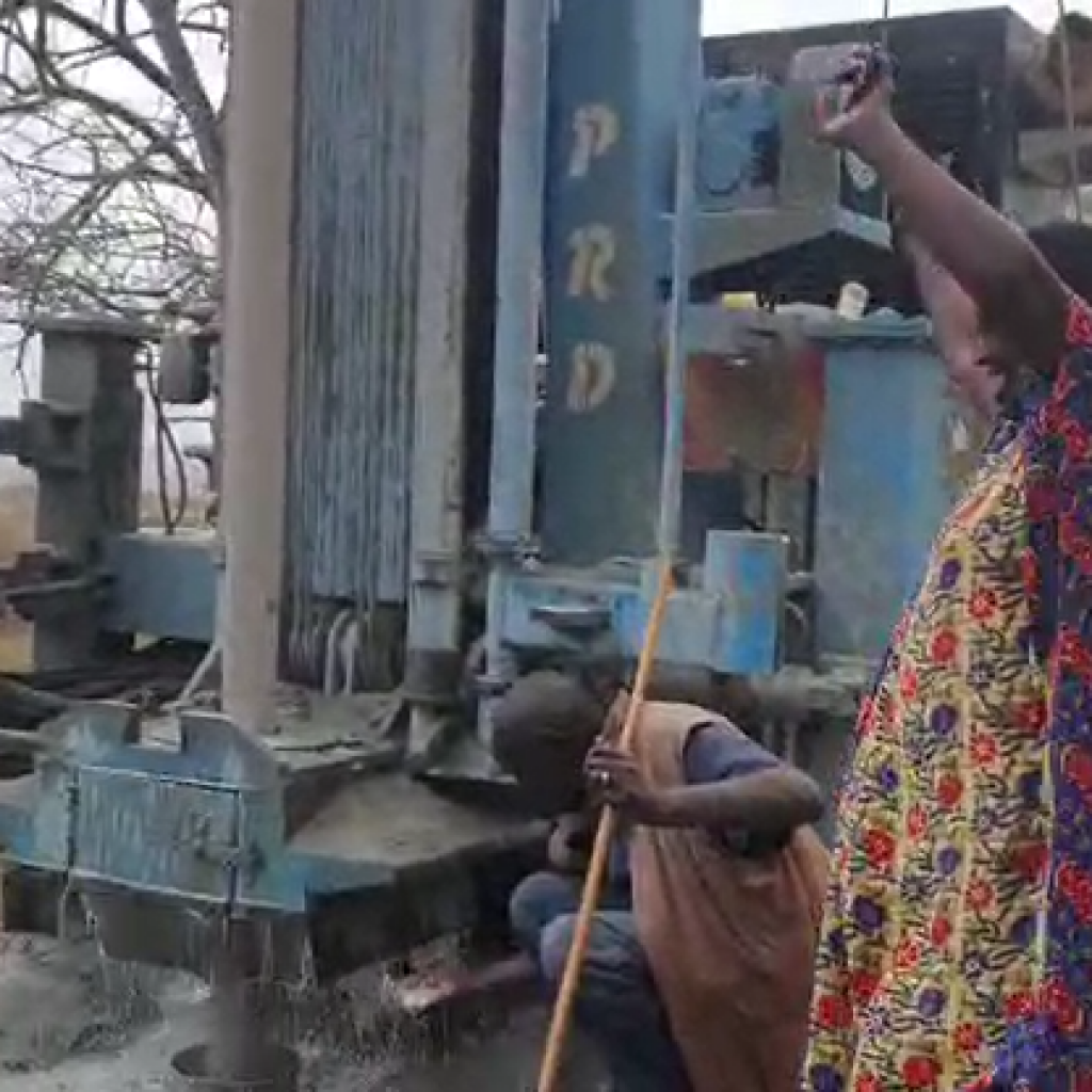 Woman celebrating the gushing stream of water